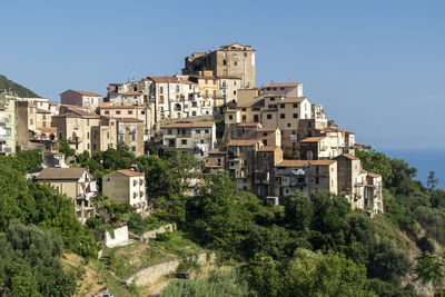 Low angle view of buildings against blue sky