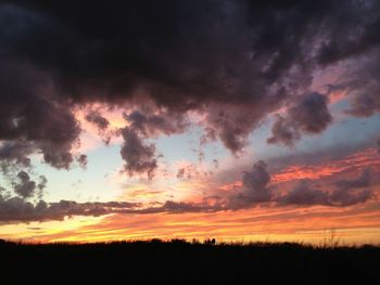 Scenic view of landscape against cloudy sky