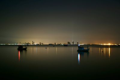 Scenic view of river against sky at night