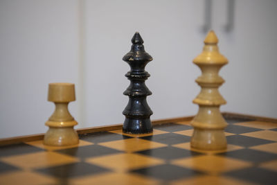 Close-up of chess pieces on table