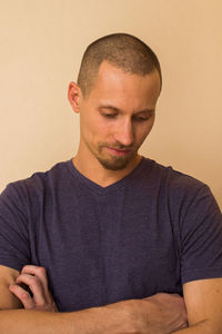Portrait of young man against white background