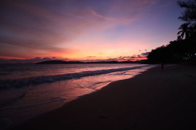 Scenic view of beach against sky during sunset
