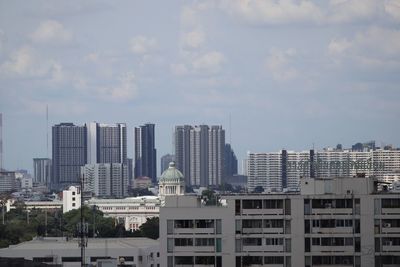 Modern cityscape against sky