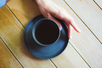 High angle view of coffee cup on table