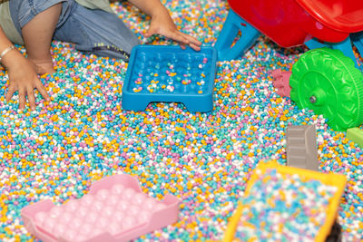 Midsection of woman holding jigsaw pieces