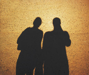 Shadow of people on sand