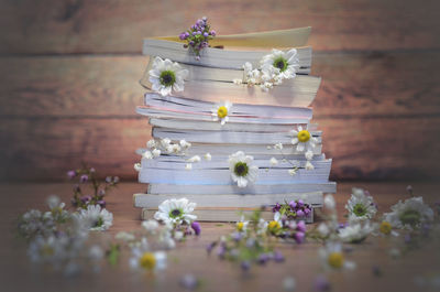 A stack of books in flowers