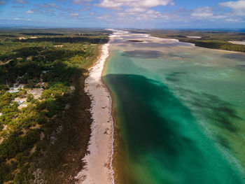 High angle view of sea shore against sky