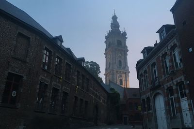 Low angle view of buildings against sky in city