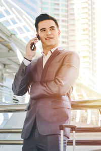 Portrait of young man using mobile phone