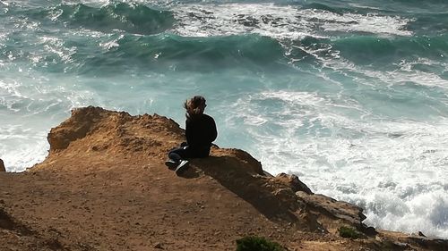 Full length of man on beach against sky