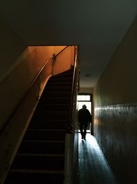 Woman walking in tunnel