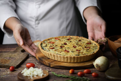 Midsection of man preparing food in kitchen