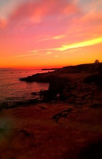 Scenic view of sea against dramatic sky