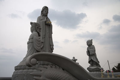 Low angle view of statue against sky