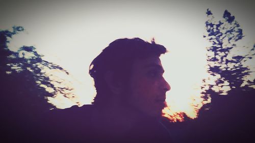 Low angle view of silhouette man against sky at sunset