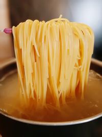 Close-up of yellow noodles in bowl
