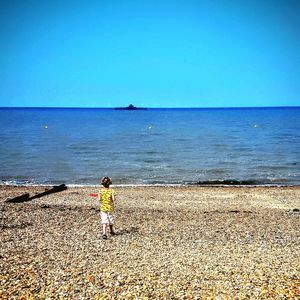 Scenic view of beach against clear sky