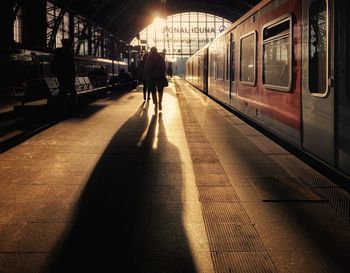 People waiting at railroad station platform