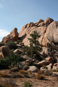 Rocks on mountain against clear sky