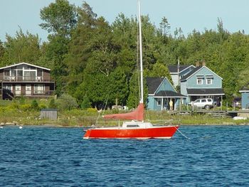 Calm sea with buildings in background