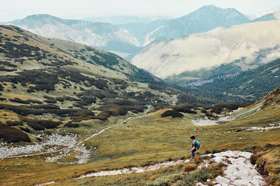 Rear view of man on mountain range