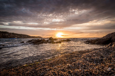 Scenic view of sea against sky during sunset