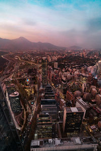 High angle view of illuminated cityscape against sky