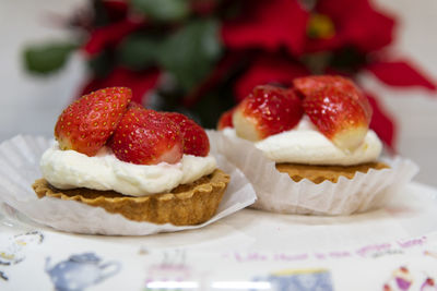Close-up of cake with strawberries on table