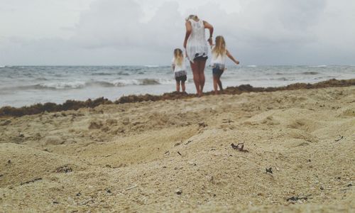 Family walking at beach