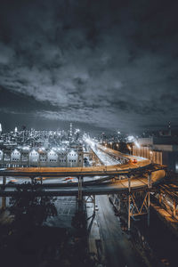 High angle view of illuminated bridge in city at night