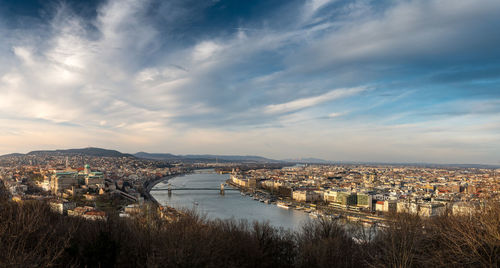 High angle view of bridge over river against buildings in city