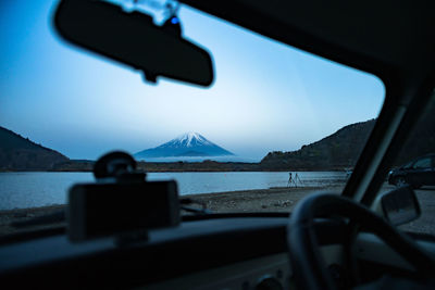 Lake seen through car windshield