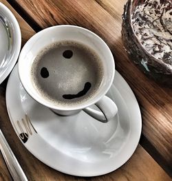 High angle view of coffee cup on table