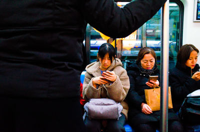 Group of people using smart phone