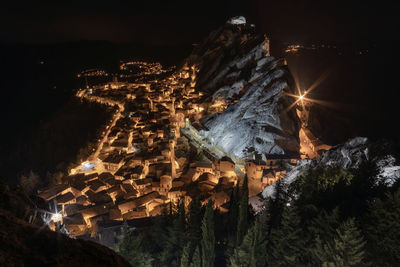 Low angle view of illuminated buildings at night