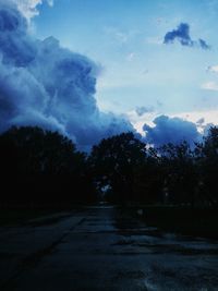Scenic view of road against cloudy sky