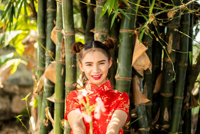 Portrait of smiling young woman outdoors