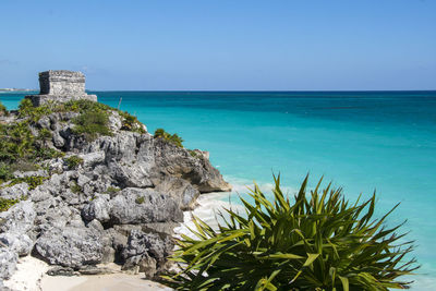 Scenic view of sea against clear blue sky