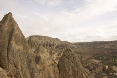 View of mountain range against cloudy sky