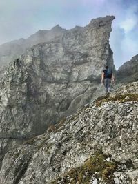 Full length of man on rock in mountains