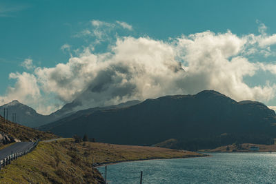 Panoramic view of lake and mountains against sky