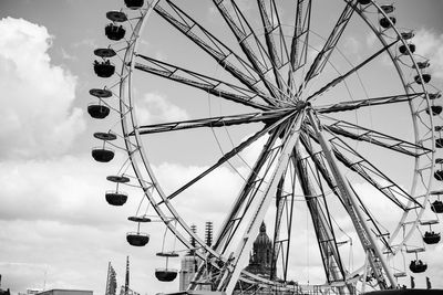 Low angle view of ferris wheel against sky