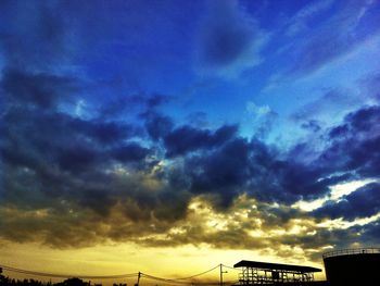 Low angle view of cloudy sky at sunset