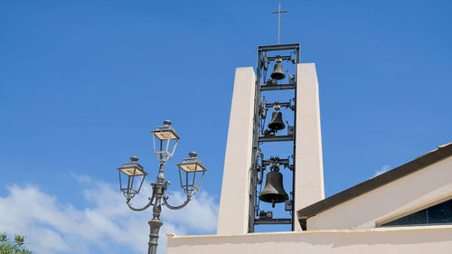 Low angle view of clock tower against sky