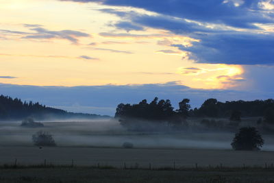 Scenic view of landscape against sky during sunset