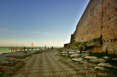 Scenic view of beach against sky during sunset