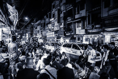 People on street in city at night