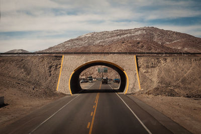 Road against cloudy sky