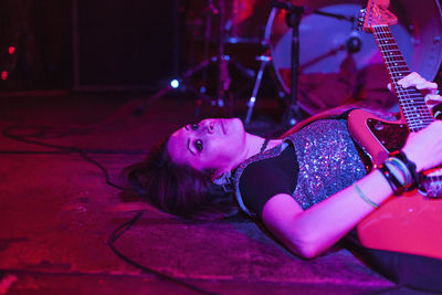 Woman lying down on stage